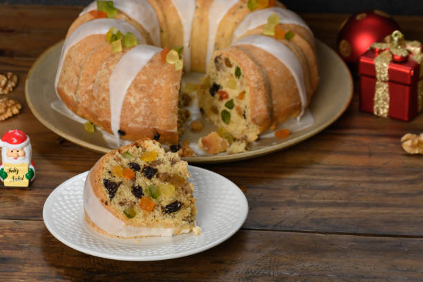 istock Christmas cake on plate, fruit cake on a wooden board 1448159203