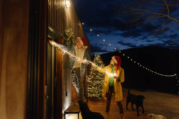 istock Putting up Christmas decorations 1448159532
