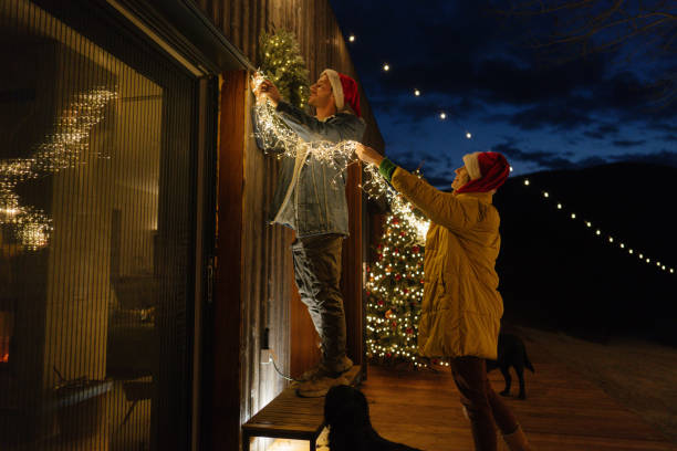istock Putting up Christmas decorations 1448159563