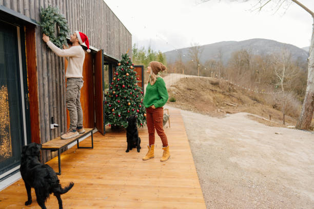istock Putting up Christmas decorations 1448159827