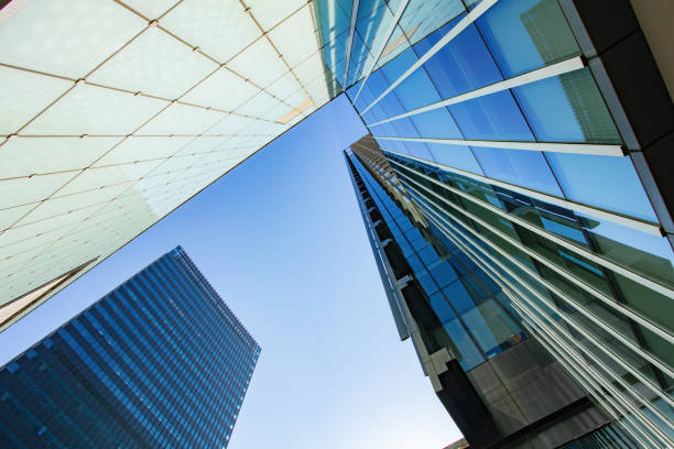 istock Low angle shot of modern office buildings and sky 1448159906