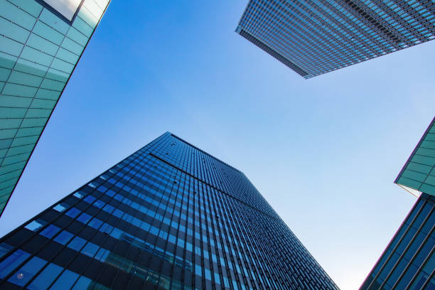istock Low angle shot of modern office buildings and sky 1448159929