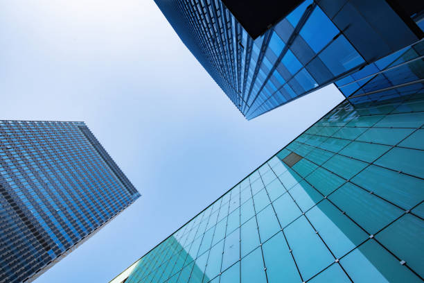 Low angle shot of modern office buildings and sky