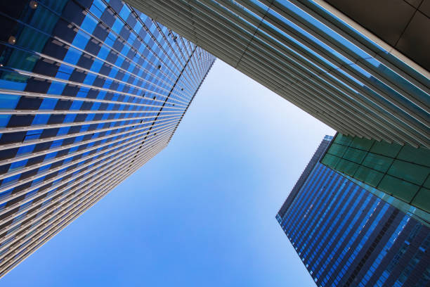 istock Low angle shot of modern office buildings and sky 1448159934