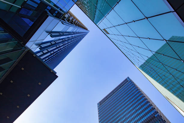 istock Low angle shot of modern office buildings and sky 1448159935
