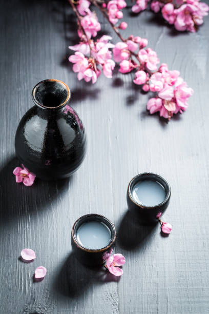istock Unfiltered Japanese sake in small black ceramics. 1448160062