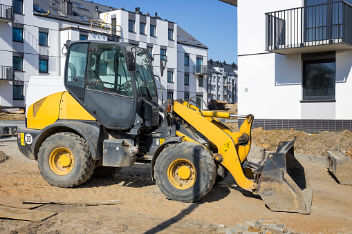 Construction machinery at the construction site of a housing estate  in the suburbs of Szczecin, Poland