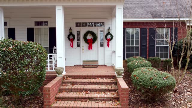 Beautiful front door decorated with wreaths for holidays