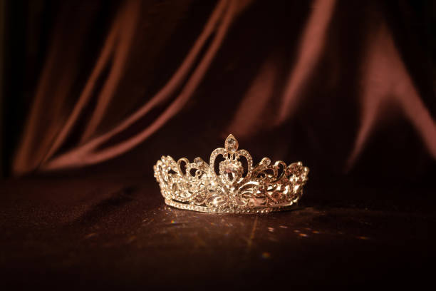 istock Elegance luxury royal crown on satin, silk background 1448166233