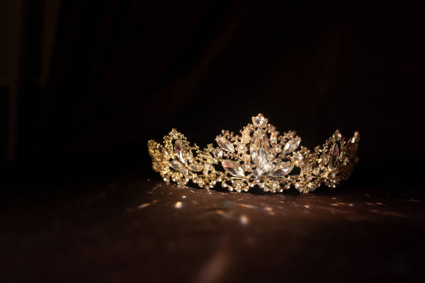 istock Luxury vintage crown on dark red satin, silk background 1448166256