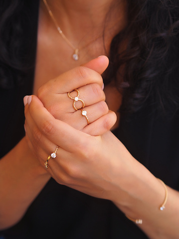 Gold ring and bracelet on a woman hand
