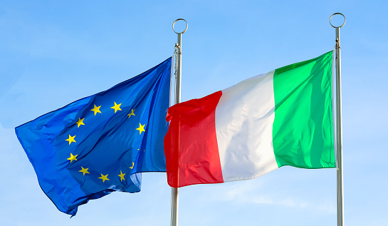 Two large waving flags of ITALY and EUROPEAN UNION