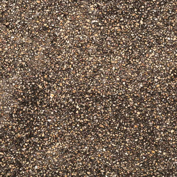 The pattern small brown pebbles stone as background. pebbles texture wall and floor.