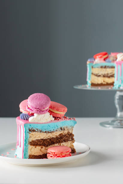 piece of cake with pink and blue decor on white table