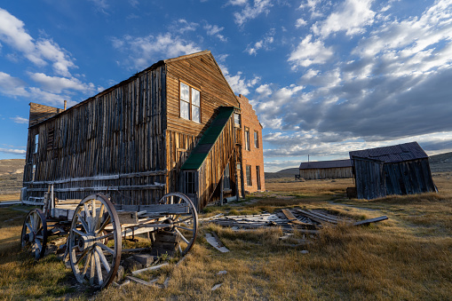 Abandoned wagon and building in Bodie, CA.  Once a bustling town of 10,000 residents in the late 1800s, it is now a ghost town and state park a few miles east of Hwy 395 south of Bridgeport, CA.