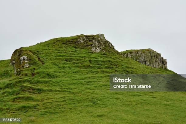Basalt Rocks Overgrown With Greenery At Coral Beach Stock Photo - Download Image Now