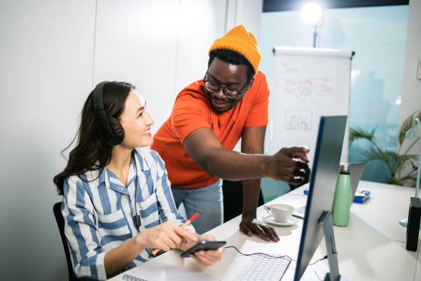 istock African man and his Asian colleague finding a business solution together 1448173831