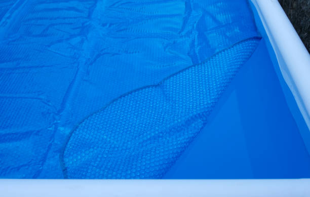 istock Pool cover. Blue solar film on the pool. 1448182441