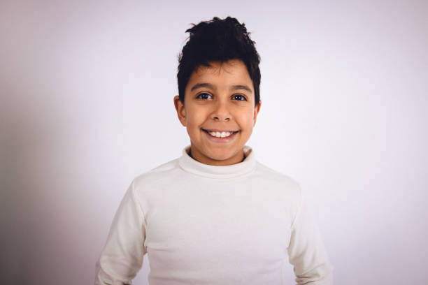 istock Young multiracial boy in a studio portrait photo 1448183411