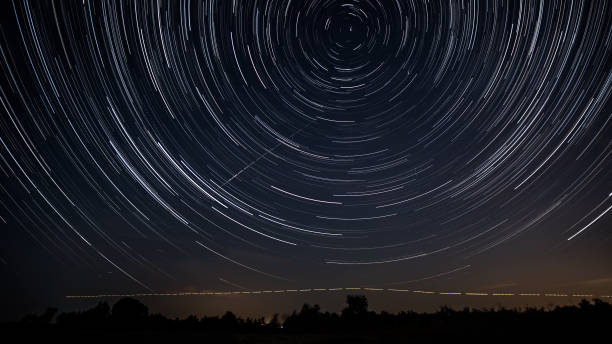 istock Star trails in the night sky 1448183442