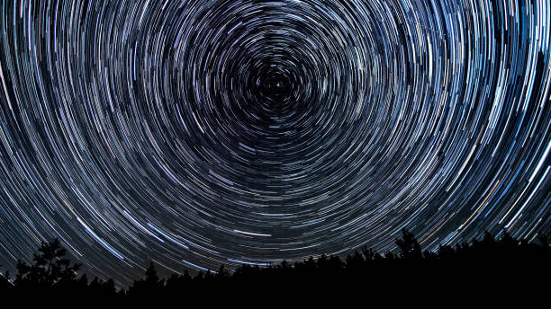 istock Star trails in the night sky 1448183472