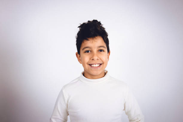 istock Young multiracial boy in a studio portrait photo 1448183482