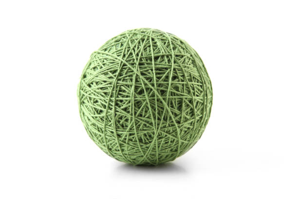 istock Green big cotton thread ball isolated on white background. 1448183544