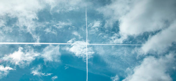 istock Getting Away. Fly Through the Blue Sky on an Airliner Leaving Footprints. Travel Concept 1448191649