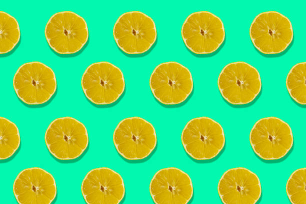 istock Fruity Pattern of Fresh Citrus Slices on a Green Background. View From Above 1448193944