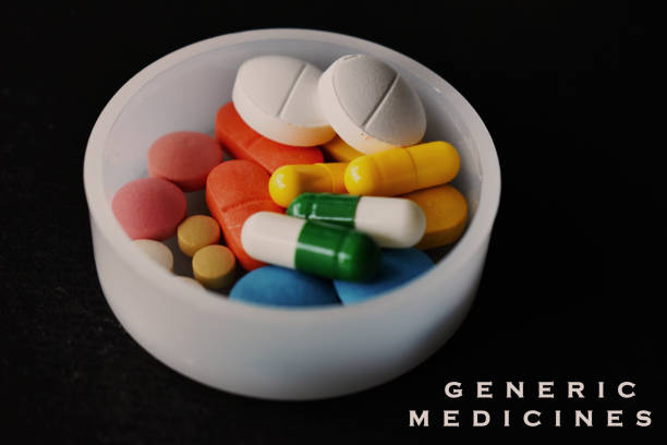 Generic medicine concept with tablets placed in white plate over black background.