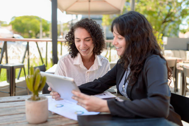 istock Finance consultant presenting business opportunities to client on digital tablet 1448197893