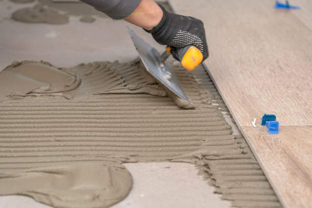 istock Laying tiles in the bathroom or kitchen 1448197945
