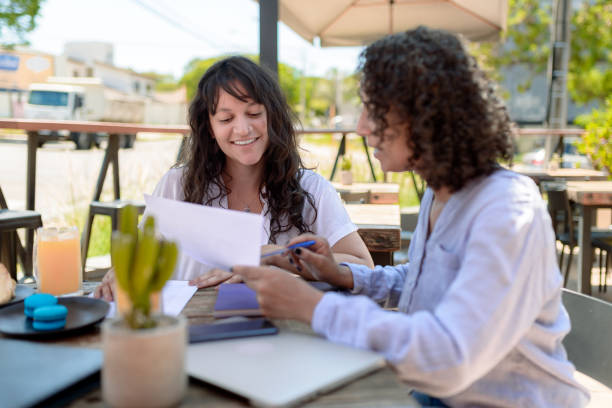 istock Real estate consultant presenting documentation to client 1448198180