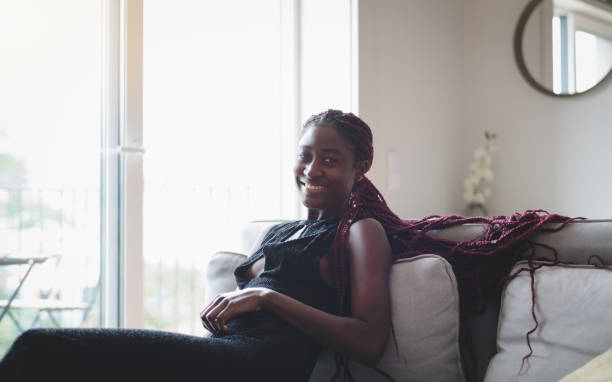 istock Pretty black girl chills on the sofa 1448205205