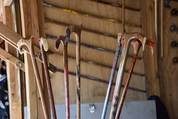 istock Handcrafted colored and patterned walking sticks for the disabled, the blind and the elderly people 1448205798