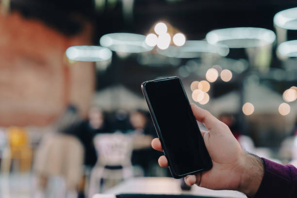 istock Man holding a phone 1448212748