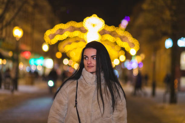 istock Beautiful young woman posing outdoors while wearing a thick winter coat 1448213604