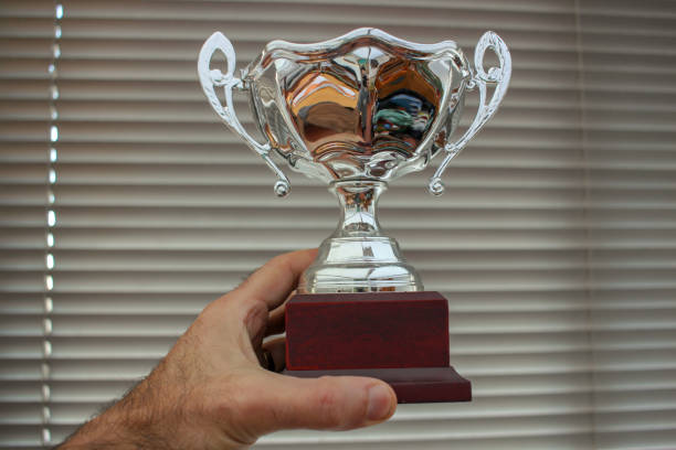istock holding a new trophy in life 1448217109