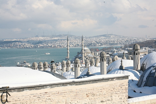 The view of Galata from the Süleymaniye Mosque is snowy in winter. photograph