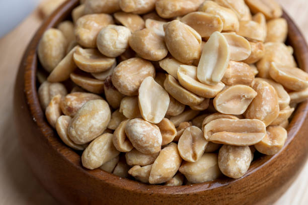 istock Peeled and roasted peanuts on the table 1448222247