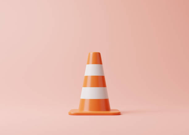 istock Orange traffic cone with white stripes on pink background 1448227289