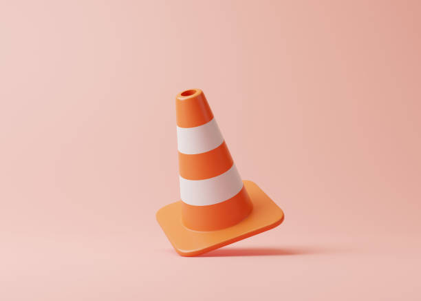 istock Orange traffic cone with white stripes on pink background 1448227301