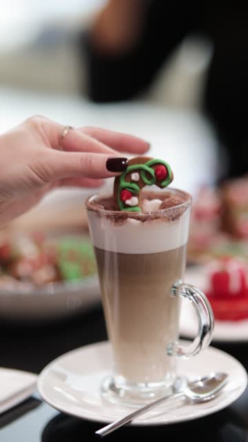 gingerbread latte with christmas cookies, dipping cookies in coffee, christmas sweets and coffee, latte and christmas cookies