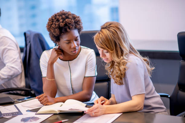 istock Working Together in a Business Meeting 1448228432