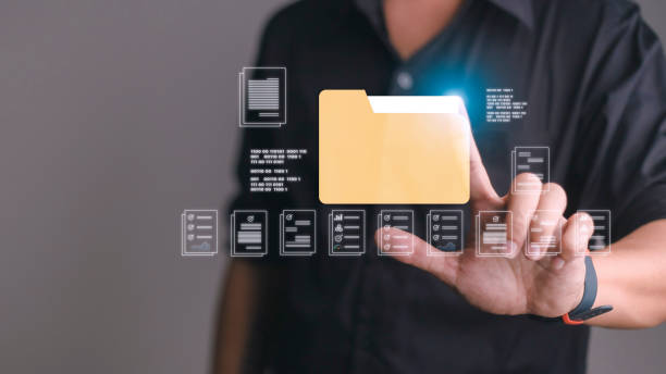 istock Businessman finger touch digital device, hud hologram with office document icons and binary. Storage of personal data information, online database. Concept of cloud service 1448235486