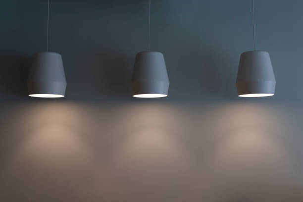 istock lamps hang on a gray wall 1448243807