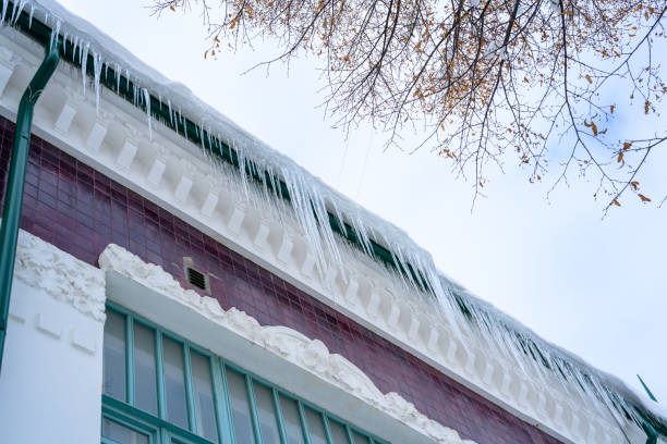 istock Close-up of icicles on the roof. 1448245803