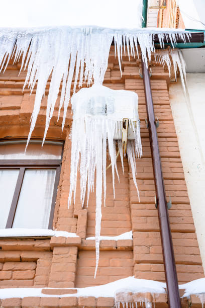 istock Close-up of icicles on the roof. 1448245837