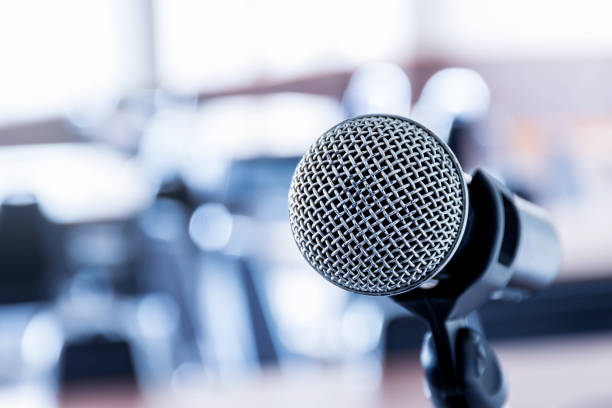 istock Close up microphone with tripod on stage in seminar room. 1448246476
