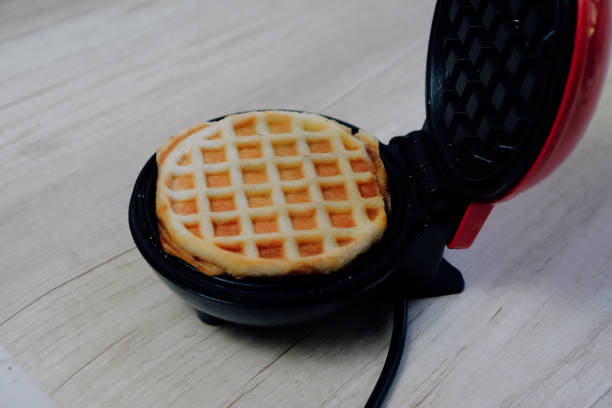 istock Mini waffles made with a mini waffle maker on the kitchen counter 1448254428